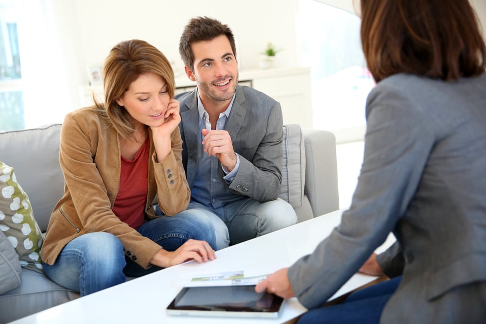 Couple meeting financial adviser for real estate project Couple meeting financial adviser for real estate project
